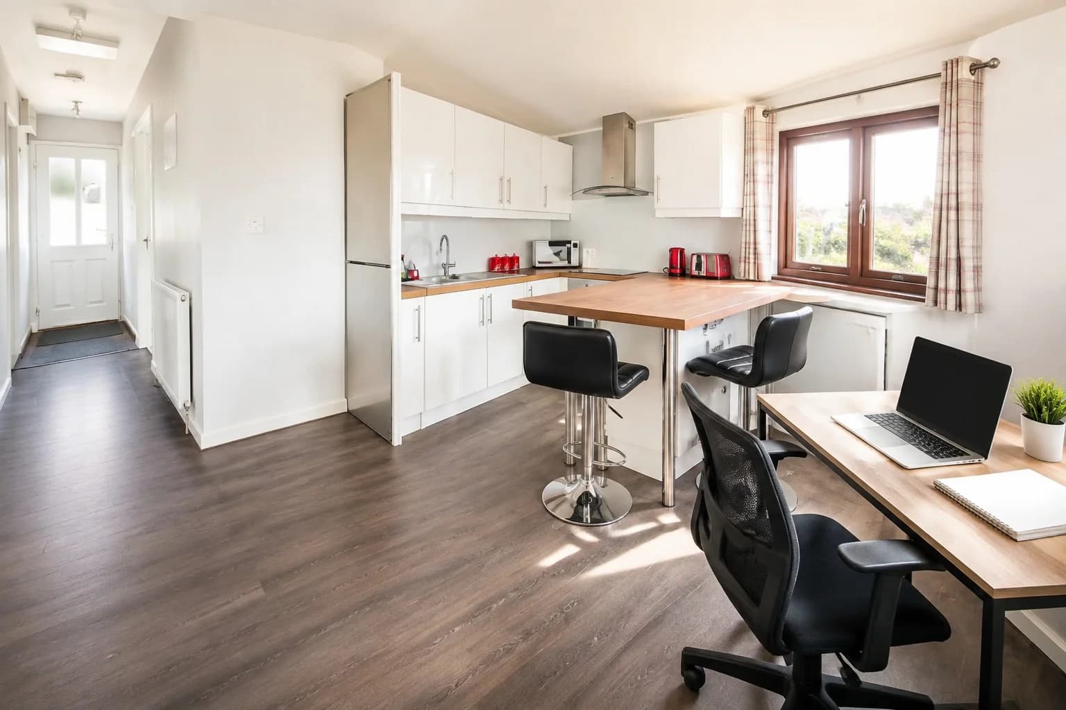Desk and workspace beside the kitchen at Mardon Holiday Home, accommodation near Inverness Campus