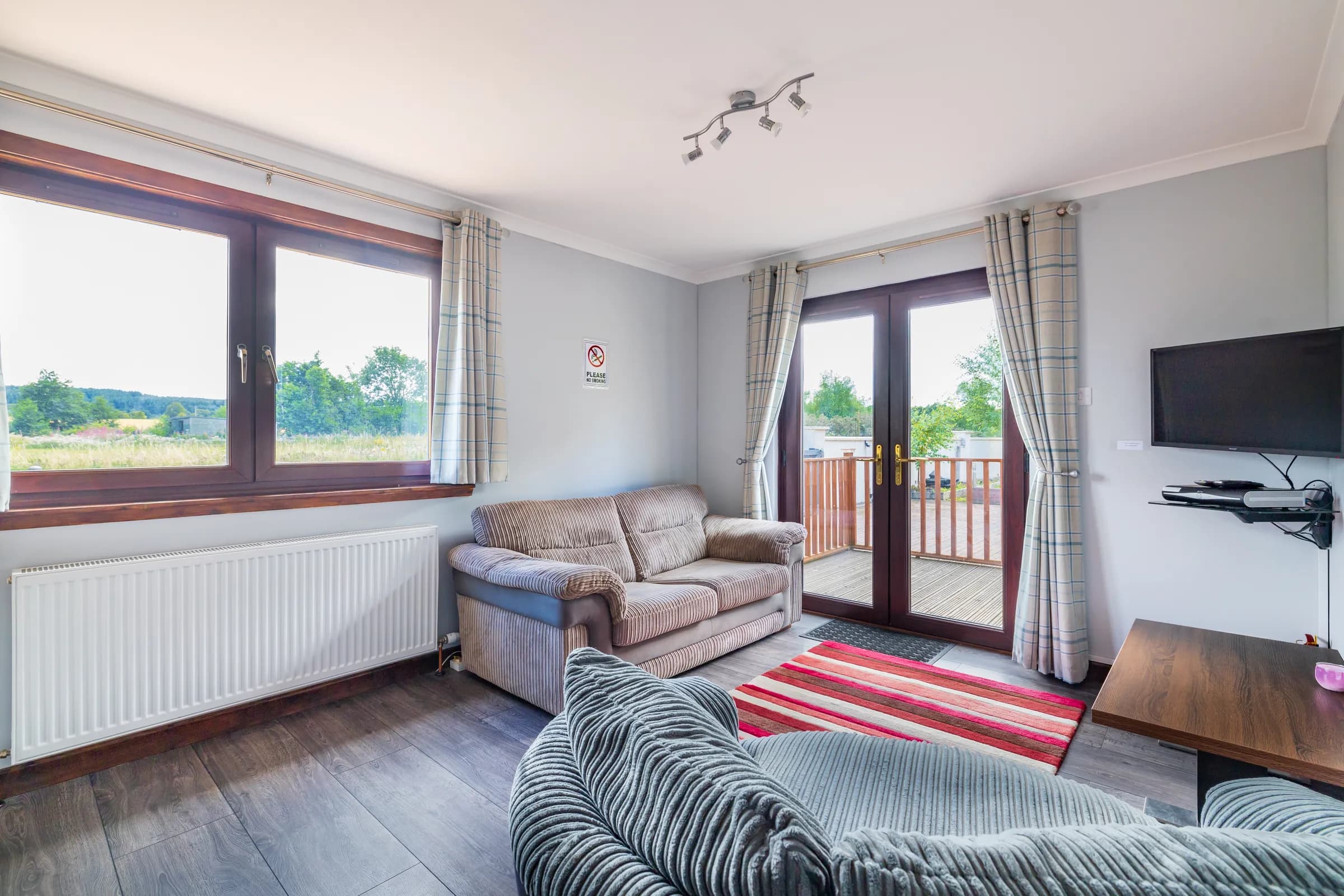 Executive Suite living area – Mardon Holiday Home Wheelchair-accessible living space in the Executive Suite at Mardon Holiday Home, accommodation near Inverness Airport